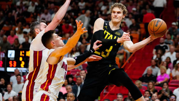 Utah Jazz forward Lauri Markkanen (23) throws a pass as Miami Heat guard Tyler Herro (14) defends during the second quarter at Miami-Dade Arena.